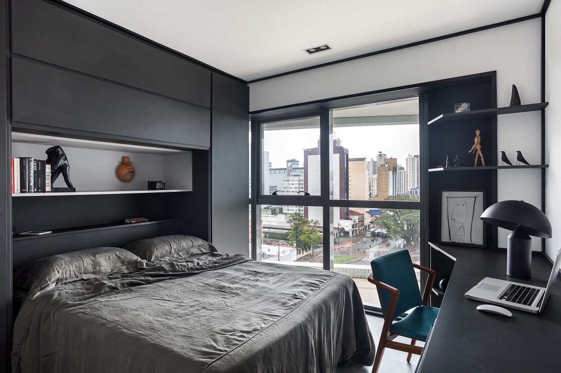 Dormitório em tons escuros de preto e cinza